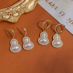 Gourd-shaped Pearl Earrings with Copper Plated Real Gold and Zircon Inlay: Light Luxury, High-End, Unique Design, Stylish and Elegant Earrings.